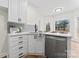 Kitchen with stainless steel appliances, white cabinets, breakfast bar and tile backsplash at 103 Devonshire Ln, Salisbury, NC 28146