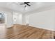 Open-concept living room with hardwood floors, high ceilings, and natural light, ideal for relaxation at 103 Devonshire Ln, Salisbury, NC 28146