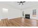 Spacious living room features a fireplace, windows, and tray ceilings at 103 Devonshire Ln, Salisbury, NC 28146
