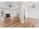 Open-concept living room features built-in bookshelves, fireplace, and a ceiling fan at 103 Devonshire Ln, Salisbury, NC 28146