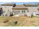 View of back of the house showing an outdoor grill and privacy fence at 1030 Archibald Ave, Fort Mill, SC 29708