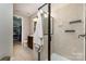 Bright bathroom features tiled floor, shower with glass door, closet, and cherry wood vanity at 1030 Archibald Ave, Fort Mill, SC 29708