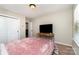 Comfortable bedroom with plush carpet, double closet, and wooden desk for entertainment at 1030 Archibald Ave, Fort Mill, SC 29708