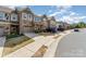 Street view of attractive townhomes with stone facade, integrated garages, and concrete driveways at 1030 Archibald Ave, Fort Mill, SC 29708