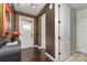 Elegant foyer featuring hardwood floors, decorative wallpaper, and a bright white front door at 1030 Archibald Ave, Fort Mill, SC 29708