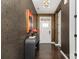 Stylish hallway with hardwood floors, decorative wallpaper, and elegant light fixture at 1030 Archibald Ave, Fort Mill, SC 29708