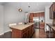 Elegant kitchen with a large island, granite countertops, and stainless steel appliances at 1030 Archibald Ave, Fort Mill, SC 29708