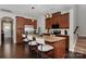Spacious kitchen featuring stainless steel appliances, dark wood flooring, and pendant lighting at 1030 Archibald Ave, Fort Mill, SC 29708