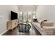 Bright living room features hardwood floors, a large window, and contemporary furnishings at 1030 Archibald Ave, Fort Mill, SC 29708
