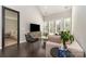 Cozy living room features hardwood floors, large windows, and contemporary furnishings at 1030 Archibald Ave, Fort Mill, SC 29708