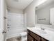 Bathroom featuring a single sink, vinyl floors, white bathtub and toilet at 105 Elk Ct, Mount Holly, NC 28120