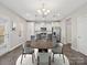 Modern kitchen with white cabinets, stainless steel appliances, and an island with seating at 105 Elk Ct, Mount Holly, NC 28120