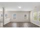 Bright living room with hardwood floors and large windows offering plenty of natural light at 105 Elk Ct, Mount Holly, NC 28120