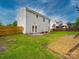 Spacious backyard with patio, pergola, and grassy area at 113 Devynn Ridge Ct, Mount Holly, NC 28120