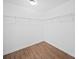 Empty closet with wire shelving and hardwood floors for easy storage solutions at 113 Devynn Ridge Ct, Mount Holly, NC 28120