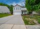 Charming two-story home with a well-maintained front yard, inviting curb appeal, and two car garage at 113 Devynn Ridge Ct, Mount Holly, NC 28120