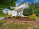 Lovely two-story home with attractive landscaping features and a lush, green lawn at 113 Devynn Ridge Ct, Mount Holly, NC 28120