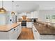 Kitchen with stainless appliances, white cabinets, and decorative backsplash at 113 Devynn Ridge Ct, Mount Holly, NC 28120