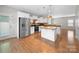 Spacious kitchen with island, stainless appliances, and white cabinetry at 113 Devynn Ridge Ct, Mount Holly, NC 28120