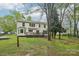Spacious backyard with a well-maintained lawn, inviting deck, and plenty of room for outdoor activities at 11333 Snapfinger Dr, Charlotte, NC 28277