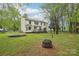 Large backyard with a deck, mature trees, and plenty of space for recreation at 11333 Snapfinger Dr, Charlotte, NC 28277