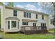 The backyard features a spacious deck, large windows, and plenty of room for outdoor enjoyment at 11333 Snapfinger Dr, Charlotte, NC 28277