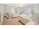 A cute bedroom with light walls, carpet floors, dresser, bookshelf, and natural light at 11333 Snapfinger Dr, Charlotte, NC 28277