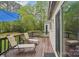 Outdoor deck with lounge chairs and a view of the landscaped backyard at 11333 Snapfinger Dr, Charlotte, NC 28277