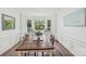 Bright dining room with natural light, rustic wood table, and cozy window seating at 11333 Snapfinger Dr, Charlotte, NC 28277