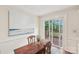 Cozy dining area with a wooden table and sliding door to a wooden deck, perfect for dining at 11333 Snapfinger Dr, Charlotte, NC 28277