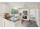 Bright kitchen featuring a peninsula, white cabinets, and black appliances with views to dining at 11333 Snapfinger Dr, Charlotte, NC 28277