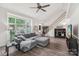 Spacious living room with vaulted ceilings, hardwood floors, and a large window for ample natural light at 11333 Snapfinger Dr, Charlotte, NC 28277