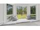 Cozy window seat with plush cushions, offering a serene view of the outdoor landscape at 11333 Snapfinger Dr, Charlotte, NC 28277