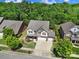 Inviting home with three-car garage, manicured lawn, and mature trees in a desirable neighborhood at 128 Front Porch Dr, Rock Hill, SC 29732
