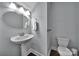 Stylish half bathroom features a pedestal sink and a modern toilet at 128 Front Porch Dr, Rock Hill, SC 29732