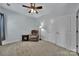 Comfortable bedroom featuring a recliner chair, side table, and a ceiling fan at 128 Front Porch Dr, Rock Hill, SC 29732