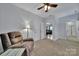 Bedroom featuring a recliner chair, side table, and a ceiling fan at 128 Front Porch Dr, Rock Hill, SC 29732