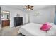 Comfortable bedroom with ceiling fan, two windows providing natural light, and a large closet at 128 Front Porch Dr, Rock Hill, SC 29732
