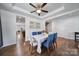 Charming dining area with hardwood floors features a modern light fixture and ample natural light at 128 Front Porch Dr, Rock Hill, SC 29732