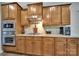Stylish kitchen features granite countertops, stainless steel appliances and dark wood cabinets at 128 Front Porch Dr, Rock Hill, SC 29732