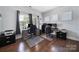 Bright home office featuring wood floors, two desks, and large windows, perfect for a productive workspace at 128 Front Porch Dr, Rock Hill, SC 29732