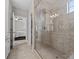 Luxurious bathroom showcases granite countertops, tile flooring, and a frameless glass shower enclosure at 130 Villa Lake Dr, Fort Mill, SC 29708