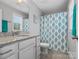 Bathroom with vanity and shower featuring blue and white patterned shower curtain at 130 Villa Lake Dr, Fort Mill, SC 29708