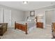 Nicely carpeted bedroom features an armchair and wooden furniture at 130 Villa Lake Dr, Fort Mill, SC 29708