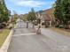 View of the gated community entrance and surrounding brick townhomes at 130 Villa Lake Dr, Fort Mill, SC 29708