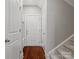 Inviting entryway with hardwood floors, white trim, and staircase access at 130 Villa Lake Dr, Fort Mill, SC 29708