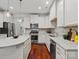 Bright kitchen featuring white cabinetry, stainless steel appliances, hardwood floors and granite countertops at 130 Villa Lake Dr, Fort Mill, SC 29708