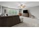 Open living room with carpet, a ceiling fan, and a comfortable seating arrangement at 130 Villa Lake Dr, Fort Mill, SC 29708