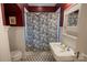 Stylish bathroom features a vintage-style sink, black and white mosaic tile flooring, and elegant fixtures at 139 S Laurel Ave, Charlotte, NC 28207