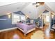Attic bedroom featuring angled ceilings, a ceiling fan, and hardwood floors at 139 S Laurel Ave, Charlotte, NC 28207